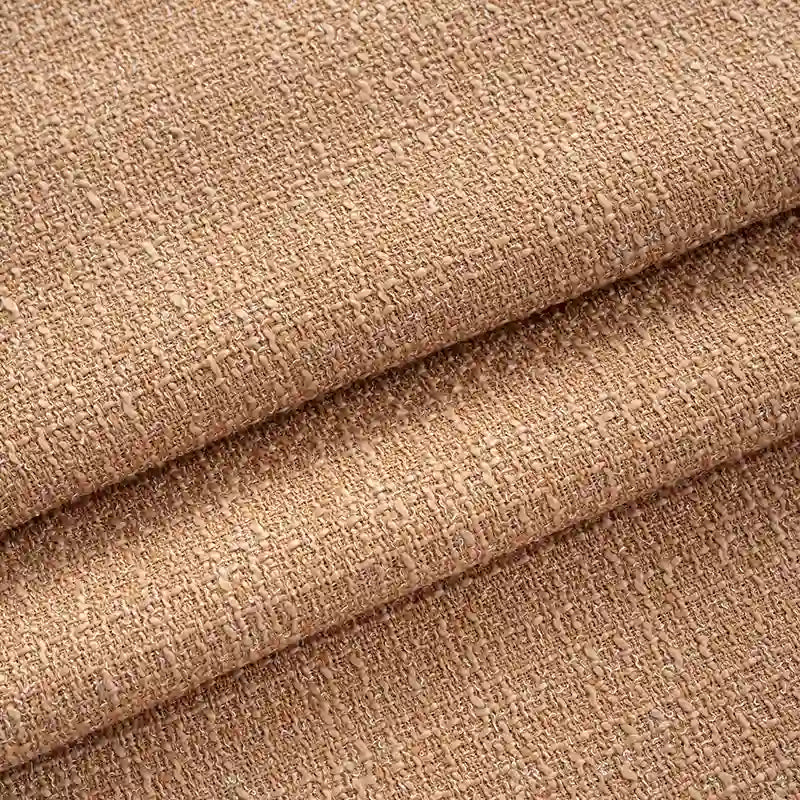 Close-up of Longan Craft’s Solid Color Tweed Fabric by the Yard—chic woven polyester ideal for suits. This durable, coarse-surfaced textile features visible fibers and slight folds, perfect for stylish clothing or home projects.