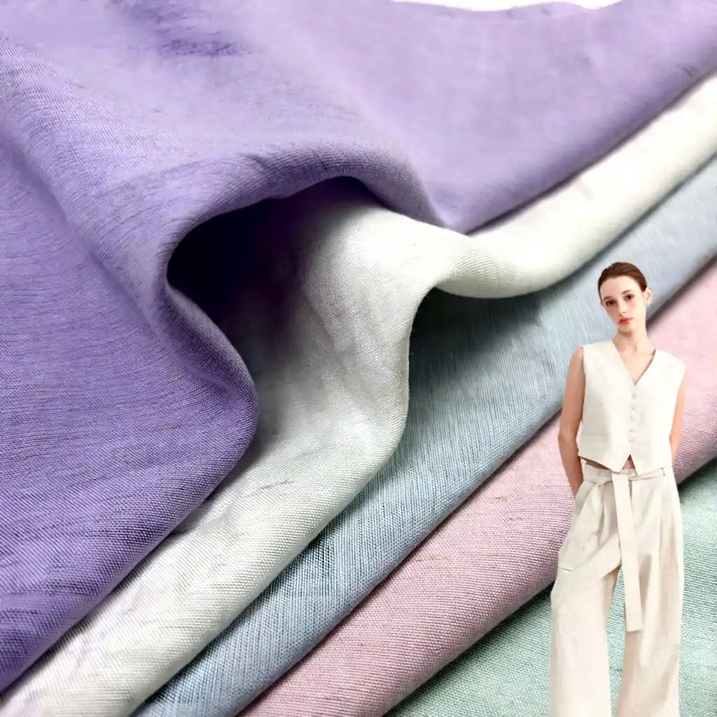 Close-up of Longan Craft's Solid Color Viscose Lyocell Fabric By The Yard in lavender, white, blue, and pink—a smooth, breathable Rayon and Linen Blend textile—shown with a woman wearing a light sleeveless lyocell top and wide-leg pants.