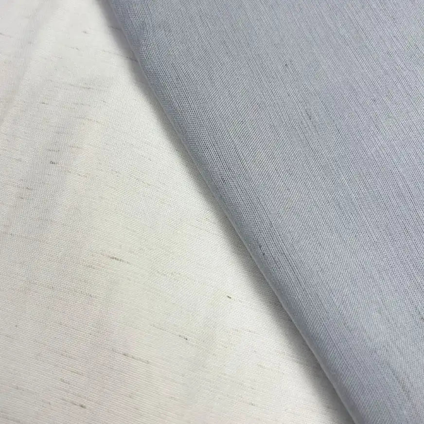 Close-up of two pieces of Longan Craft Solid Color Viscose Lyocell Fabric by the yard, one white and one light gray, with a visible seam. This smooth, breathable rayon-linen blend textile features a slightly textured, woven appearance.