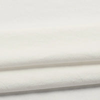 A close-up of two folded pieces of Longan Craft’s Solid Color Washed Crepe Fabric By The Yard, made from 100% cotton, highlights their soft textured surface and clean appearance—ideal for crafting pants and clothing.