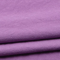 A close-up view of Longan Craft’s Solid Color Washed Crepe Fabric By The Yard, a 100% cotton crepe clothing material in light purple, featuring a soft, slightly textured surface ideal for pants.