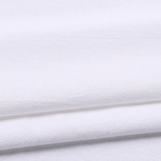 A close-up of Solid Color Washed Crepe Fabric by the yard from Longan Craft, made from 100% cotton, neatly folded to highlight its soft and textured surface—perfect for pants and other clothing projects.