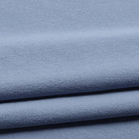 Longan Craft’s Solid Color Washed Crepe Fabric By The Yard features 100% cotton crepe material in a light blue shade, neatly folded to reveal subtle horizontal lines and shadows. With its soft, smooth texture and gentle drape, this evenly colored fabric is ideal for pants or any sewing project requiring a lightweight, solid color cotton crepe.
