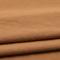 Three layers of Longan Craft’s Solid Color Washed Crepe Fabric By The Yard, made from 100% cotton, are stacked to highlight their soft, textured surface and subtle creases—making this crepe clothing material ideal for pants or other apparel projects.
