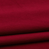 Close-up of folded Longan Craft Solid Color Washed Crepe Fabric by the yard, made from 100% cotton with a soft, smooth texture and gentle creasing—ideal for pants and clothing projects.