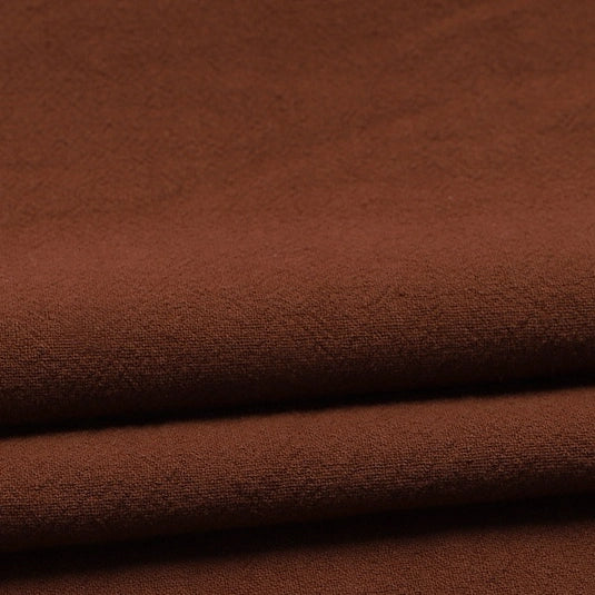 A close-up of Longan Craft’s Solid Color Washed Crepe Fabric by the yard, made from 100% cotton, showing its soft, gently textured surface—ideal for pants and other clothing projects.