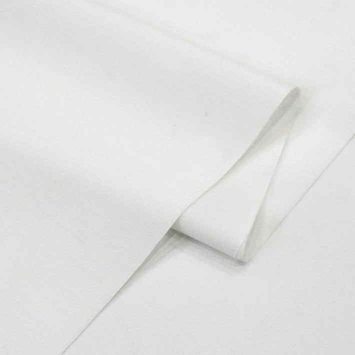 A close-up of Longan Craft's Solid Cotton Lawn Fabric by the Yard, a neatly folded, smooth-textured polyester lawn cloth material for cozy dresses, displayed against a white background.