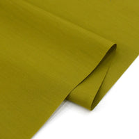 A close-up of Longan Craft's Solid Cotton Lawn Fabric By The Yard, a cozy cotton-polyester lawn cloth material, neatly folded to showcase its smooth texture and matte finish.