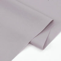 A close-up of Longan Craft’s Solid Cotton Lawn Fabric By The Yard shows its smooth, light grey polyester lawn cloth material, neatly folded to highlight the soft, breathable texture and clean edges.