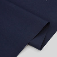 A close-up of Longan Craft’s Solid Cotton Lawn Fabric by the Yard, a dark navy blue polyester lawn cloth, neatly folded to display its smooth texture and clean edges—ideal cozy lawn dress fabric.