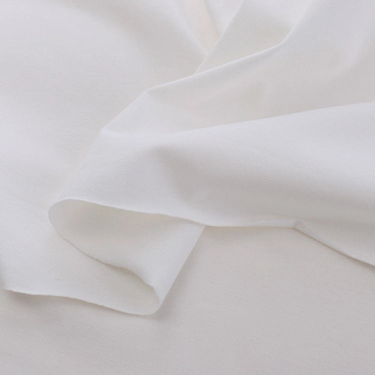 Close-up of Longan Craft’s Spandex Jersey Fabric By The Yard—a solid color cotton jersey with subtle four-way stretch, soft folds, and a slightly textured surface, perfect for stretch jersey dress projects.