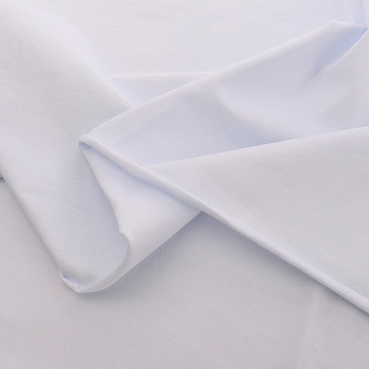 Longan Craft's Spandex Jersey Fabric By The Yard is folded and layered to display its soft texture, subtle sheen, and excellent four-way stretch against a light background. Ideal as a solid color cotton jersey fabric for dresses or crafts.