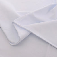 Longan Craft's Spandex Jersey Fabric By The Yard is folded and layered to display its soft texture, subtle sheen, and excellent four-way stretch against a light background. Ideal as a solid color cotton jersey fabric for dresses or crafts.