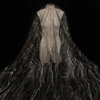 Longan Craft’s Sparkle Glitter Tulle Fabric By The Yard, a multicolor shiny tulle, drapes delicately for flowing evening gowns or dreamy veils—capturing a stunning effect against dark backgrounds.