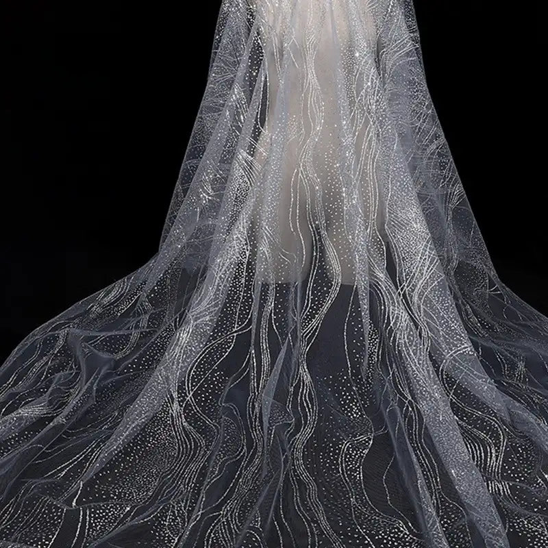 Longan Craft's Sparkle Glitter Tulle Fabric By The Yard features multicolor shine, wavy lines, and dotted patterns for a sparkling effect—perfect for evening gowns or veils. Delicate, elegant tulle shown against a black background.