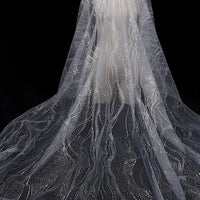 Longan Craft's Sparkle Glitter Tulle Fabric By The Yard features multicolor shine, wavy lines, and dotted patterns for a sparkling effect—perfect for evening gowns or veils. Delicate, elegant tulle shown against a black background.