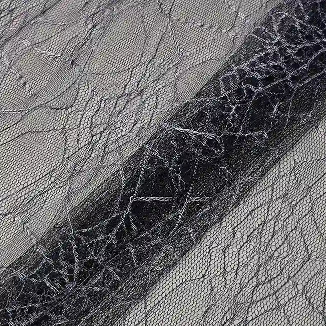 Close-up of Longan Craft’s Spider Web Tulle Fabric By The Yard—colorful, sheer material with a web-like pattern, ideal for DIY Halloween costumes, party dresses, or festive decorations.