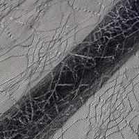 Close-up of Longan Craft’s Spider Web Tulle Fabric By The Yard—colorful, sheer material with a web-like pattern, ideal for DIY Halloween costumes, party dresses, or festive decorations.