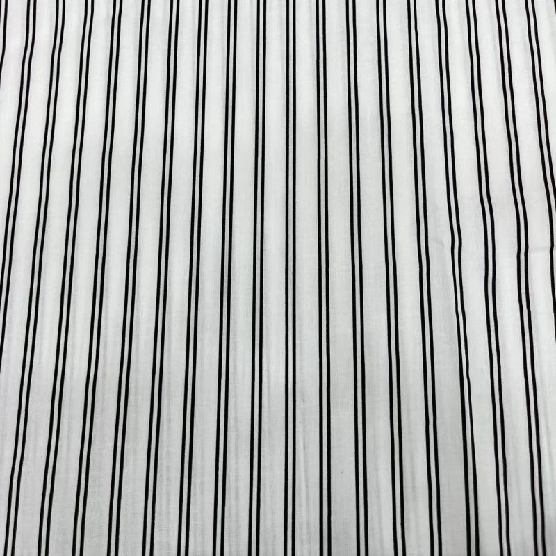 The Striped Cotton Lawn Fabric by Longan Craft features colorful printed stripes, offering a fresh, chic look—ideal for summer apparel or premium shirting. Available by the yard for dressmaking projects.