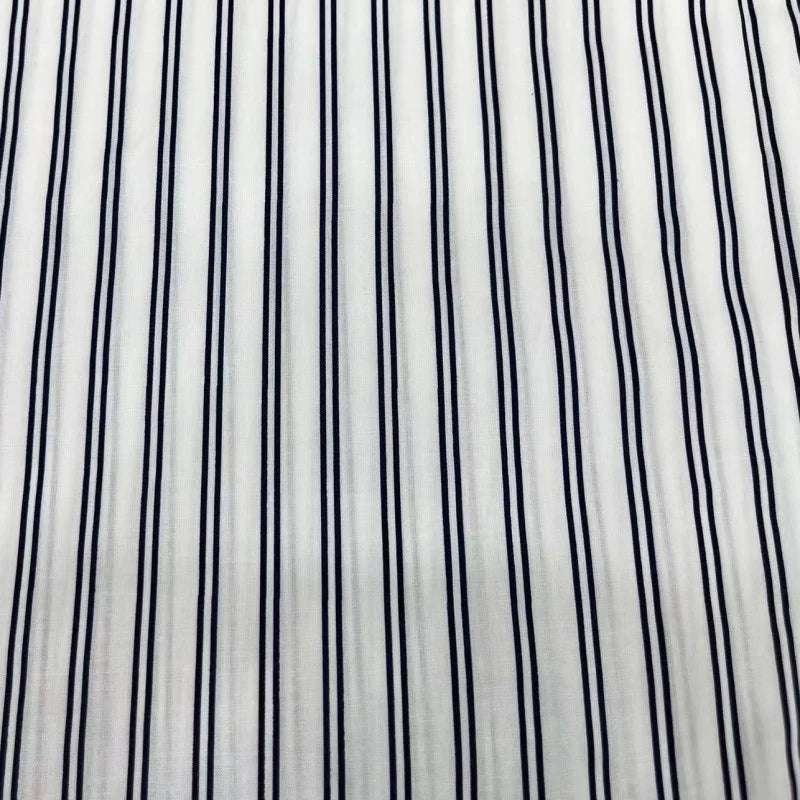 Close-up of Striped Cotton Lawn Fabric By The Yard from Longan Craft—features colorful printed stripes, ideal for airy summer shirting or dressmaking.