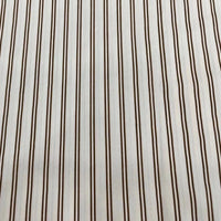 The Striped Cotton Lawn Fabric by Longan Craft features evenly spaced vertical brown stripes on white cotton, offering a simple, classic look—ideal for summer apparel and dressmaking projects. Available by the yard.