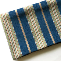 A folded piece of Longan Craft Striped Jacquard Chenille Fabric by the yard, made from 100% poly chenille with wide blue and narrow beige, green, and brown stripes on white—perfect for upholstery or sofa cushions.