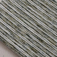 Close-up of Longan Craft’s Striped Jacquard Chenille Fabric By The Yard, a colorful poly woven chenille with horizontal gray, white, and green stripes. Durable upholstery material with a layered, tactile look.