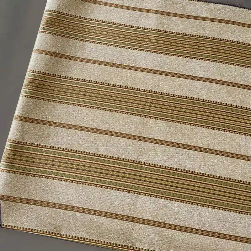 A close-up of Longan Craft’s Striped Jacquard Chenille Fabric by the yard, featuring beige with brown, tan, and gold stripes—100% poly chenille upholstery material ideal for elegant cushions and home décor.