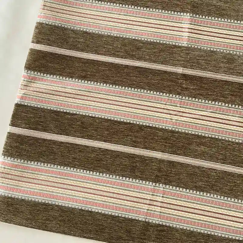 Longan Craft's Striped Jacquard Chenille Fabric by the yard features brown, beige, and pink horizontal stripes with a textured pattern. Made of 100% poly chenille, it's ideal for upholstery or cushions and offered as high-quality material.