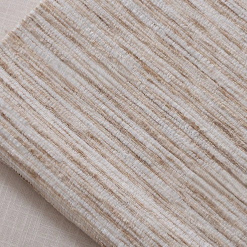 A close-up of Longan Craft’s Striped Jacquard Chenille Fabric By The Yard shows its ribbed, colorful poly woven texture atop a smooth, light surface—perfect as durable chenille upholstery material.