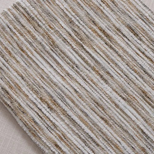 A close-up of Longan Craft’s Striped Jacquard Chenille Fabric By The Yard reveals vertical, wavy lines in beige, taupe, cream, and white on a durable, colorful poly woven chenille material with a soft striped pattern over plain upholstery.