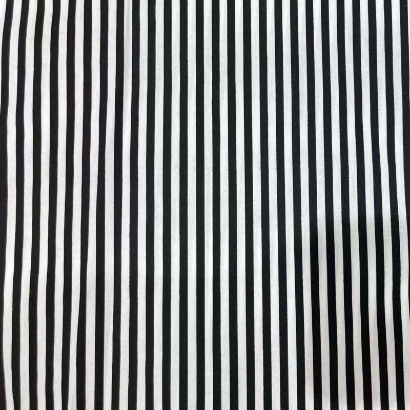Longan Craft's Striped Print Lawn Fabric By The Yard features evenly spaced vertical black and white stripes on pure cotton lawn, perfect as a soft material for shirts.