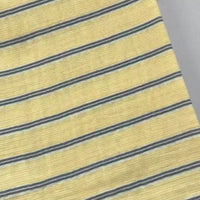 Longan Craft’s Striped Printed Gauze Fabric by the yard features yellow, gray, and white stripes. Made from double 100% cotton gauze, this breathable material is cozy with a slightly ribbed texture and shown photographed at an angle.