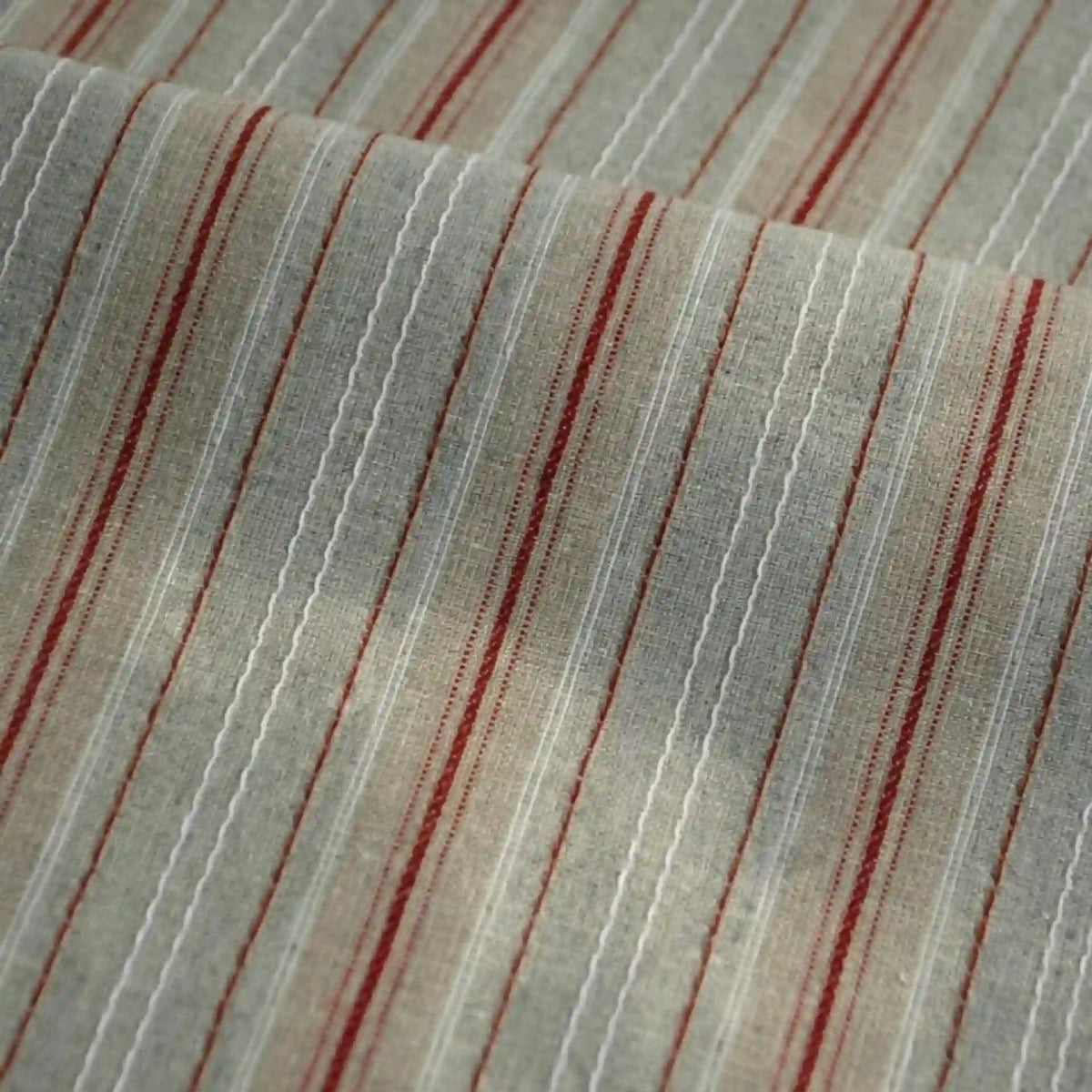 Experience the soft texture and vibrant linear pattern of the Striped Printed Linen Fabric By The Yard by Longan Craft, a breathable cotton linen blend featuring colorful vertical stripes of varying thicknesses. Shown in a close-up with gentle folds, this fabric’s detailed stripe design makes it perfect for dresses and creative projects.