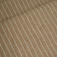 Close-up of Longan Craft’s Striped Printed Linen Fabric by the yard, a cotton linen blend featuring a colorful stripe pattern and breathable texture, with diagonal white pinstripes and visible fold in the material—ideal for dresses.