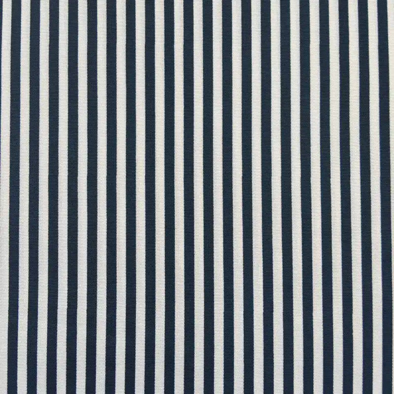 Close-up of Longan Craft's Striped Printed Peachskin Fabric By The Yard—polyester with a soft, wrinkle-resistant texture and evenly spaced vertical black and white stripes, ideal for DIY clothing projects.