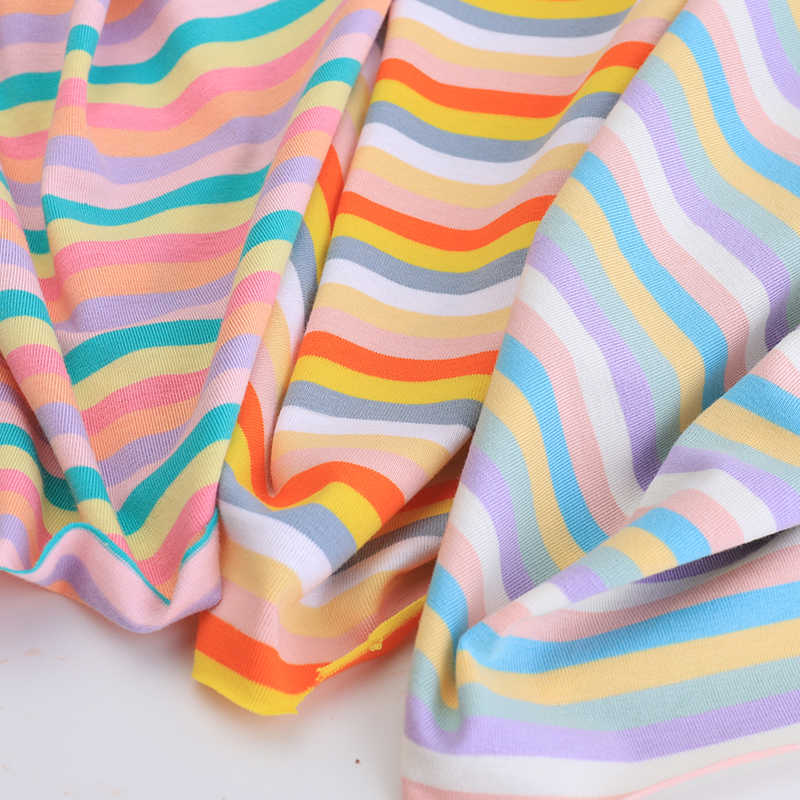 Close-up of Longan Craft Striped Jersey Fabric by the Yard, a comfy, stretchable cotton spandex jersey with wavy pastel stripes—ideal for stylish DIY short sleeves and breathable wear.