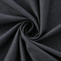 Close-up of Longan Craft Thick Cotton Gabardine Fabric, twisted in a spiral to show its soft texture and subtle twill weave. Plain color heavyweight gabardine—ideal material for uniforms, sold by the yard.