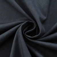 Close-up of Longan Craft’s Thick Cotton Gabardine Fabric By The Yard, a plain color twill gabardine ideal for uniforms, highlighting its smooth texture and refined weave in a twisted swirl arrangement.