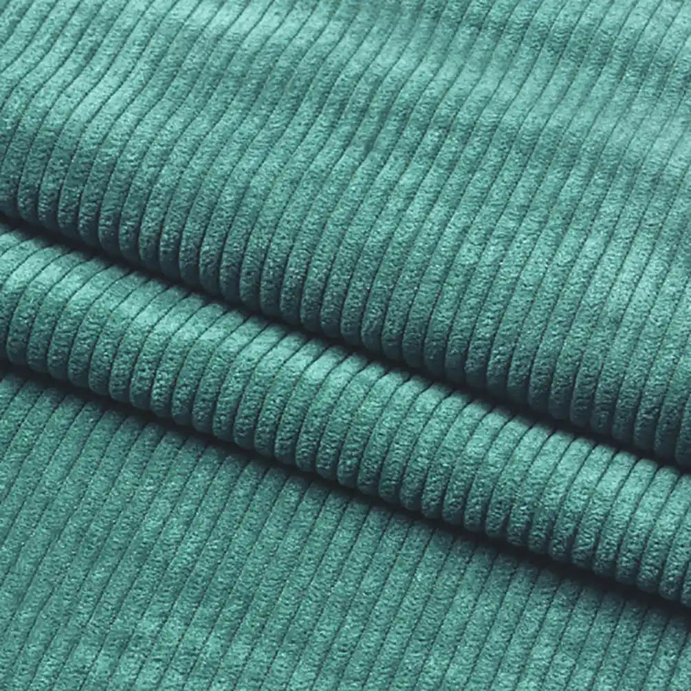 Close-up of Longan Craft Thick 8 Wale Corduroy Fabric By the Yard shows its soft teal upholstery texture and evenly spaced vertical ridges, with two folds clearly visible.