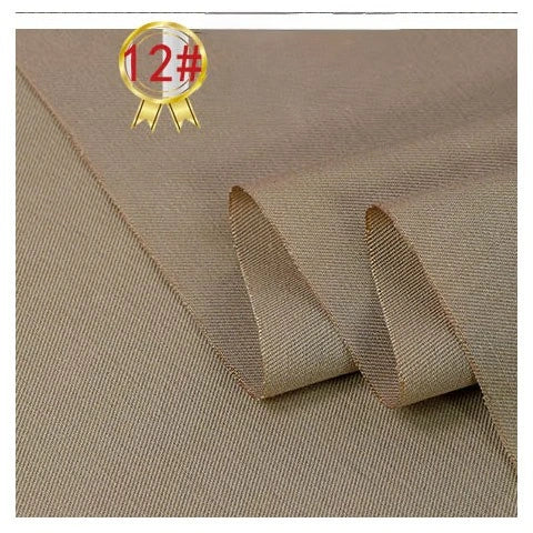 Close-up of Longan Craft’s Twill Cotton Lyocell Fabric By The Yard, featuring a smooth, slightly textured light brown surface. A gold ribbon icon with 12# appears in the top left corner. Ideal for comfy and breathable shirts.