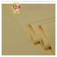 Longan Craft’s Twill Cotton Lyocell Fabric By The Yard is shown folded in light yellow with a smooth, slightly textured surface. A gold 13# ribbon appears inside a red circle at the top left corner.
