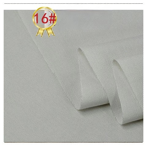 A close-up of Longan Craft's Twill Cotton Lyocell Fabric By The Yard in light gray, showing its subtle diagonal weave and a slightly folded edge, with a gold-rimmed badge marked 16# in the top left corner.