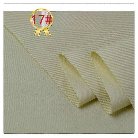 Close-up of Longan Craft's Twill Cotton Lyocell Fabric By The Yard in light beige—smooth with slight texture. A gold badge with 17# in a red circle appears at the top left, highlighting this comfy and breathable shirt material.