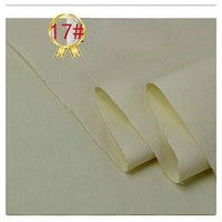 Close-up of Longan Craft's Twill Cotton Lyocell Fabric By The Yard in light beige—smooth with slight texture. A gold badge with 17# in a red circle appears at the top left, highlighting this comfy and breathable shirt material.