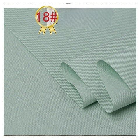 Light green Twill Cotton Lyocell Fabric by Longan Craft, folded with a subtle diagonal weave, 18# badge and ribbon in the upper left corner on a plain white background. Breathable material ideal for shirts.