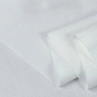 A close-up of Longan Craft’s Twill Cotton Lyocell Fabric by the yard—solid white, soft, smooth, and breathable—folded neatly against a plain background, perfect for comfy shirts.