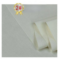 A close-up of Longan Craft's Twill Cotton Lyocell Fabric By The Yard in off-white, folded on a flat surface, with a gold badge featuring "2#" in red at the top left corner.
