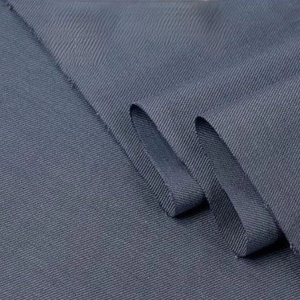 Close-up of Longan Craft's Twill Cotton Lyocell Fabric By The Yard, a comfy and breathable solid color textile with a subtle diagonal ribbed texture, neatly folded to show both surface and edges—ideal for shirts.