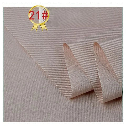 A close-up of Longan Craft's Twill Cotton Lyocell Fabric By The Yard, neatly folded to show its smooth, solid-colored texture, with a gold ribbon icon labeled “21#” in the upper left corner. Ideal comfy and breathable textile for shirts.